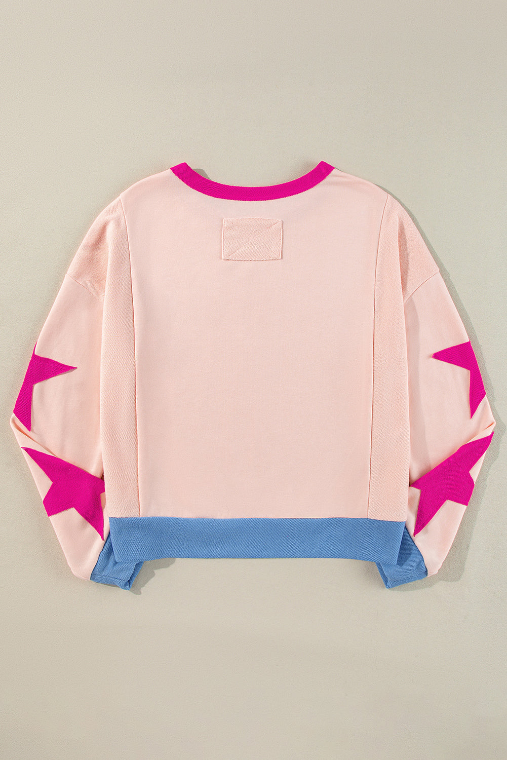 Arabella – Oversized Star Patchwork Sweatshirt with Exposed Seams